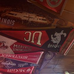 Art's Tavern - The ceiling is adorned with collegiate flags.  Go UC!