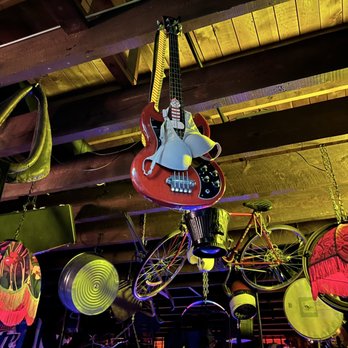 Humpin Hannah's - a guitar hanging from the ceiling - Bars Near Me - Boise, Idaho