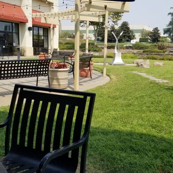 Sizzle Mongolian BBQ - Grassy areas with metal outdoor tables and chairs. - Mongolian Near Me - Rocklin, California Sizzle Mongolian BBQ - Grassy areas with metal outdoor tables and chairs. - Mongolian Near Me - Rocklin, California