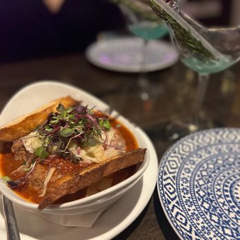 PIAF KITCHEN + WINE + BAR - a bowl of food on a table - Mediterranean Near Me - Grapevine, Texas PIAF KITCHEN + WINE + BAR - a bowl of food on a table - Mediterranean Near Me - Grapevine, Texas