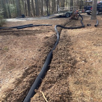 Danny's Lawn Care - a drainage pipe in the middle of the yard - Landscaping Near Me - Durham, North Carolina