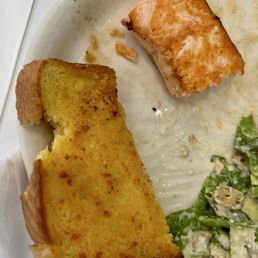 Restaurants normally don't serve a piece of garlic bread like this. It looks like somebody pinched or took a bite off of it. Restaurants normally don't serve a piece of garlic bread like this. It looks like somebody pinched or took a bite off of it.