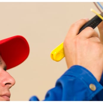 Changepro Usa - a professional electrician working on an electrical panel - General Contractors Near Me - Reston, Virginia Changepro Usa - a professional electrician working on an electrical panel - General Contractors Near Me - Reston, Virginia