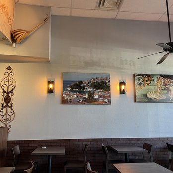 The Greek Pita - a dining area with tables and chairs - Greek Near Me - Phoenix, Arizona The Greek Pita - a dining area with tables and chairs - Greek Near Me - Phoenix, Arizona