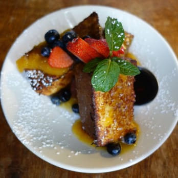 The Universal - Custard Toast - Soaked in Nutmeg Custard Overnight, Griddled, Baked, Garnished with Orange Marmalade and Berries - Breakfast & Brunch Near Me - Denver, Colorado The Universal - Custard Toast - Soaked in Nutmeg Custard Overnight, Griddled, Baked, Garnished with Orange Marmalade and Berries - Breakfast & Brunch Near Me - Denver, Colorado