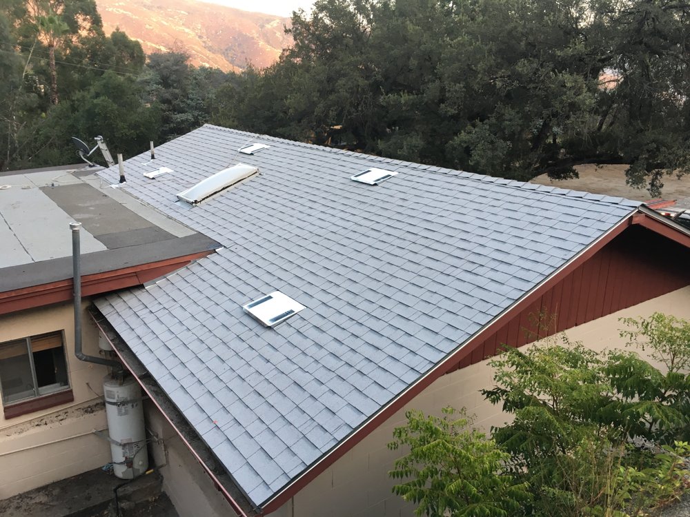 Slide of R Squared Roofing Services