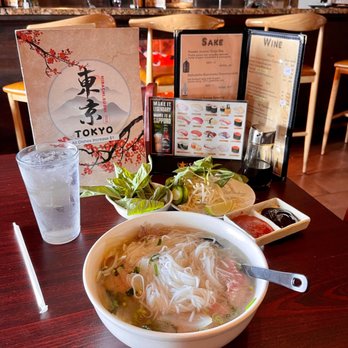 Tokyo Japanese Steakhouse - a bowl of soup and a plate of rice noodles - Sushi Bars Near Me - Walla Walla, Washington