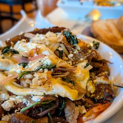 Greek Prime Kitchen & Bar - Greek skillet with added onions. Being treated to world class service by Andres.