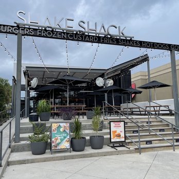 Shake Shack I-Drive - Main Entrance and Outdoor seating - Ice Cream & Frozen Yogurt Near Me - Orlando, Florida Shake Shack I-Drive - Main Entrance and Outdoor seating - Ice Cream & Frozen Yogurt Near Me - Orlando, Florida