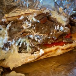 Athenian's Gyros & Chicken - Gyro in Pita with homemade tzatziki sauce, onions & tomatoes...absolutely delicious!!!!!