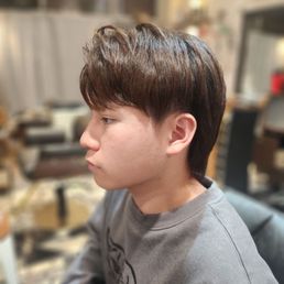 He had a perm in the front and a downperm on the back. Also got some trimming and texturing.