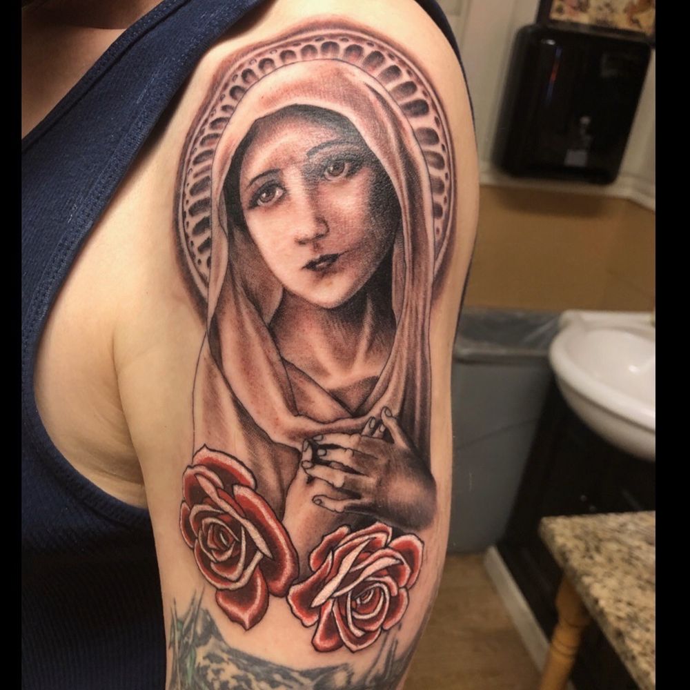Tattoo of the Virgin Mother with roses. Tattoo of the Virgin Mother with roses.