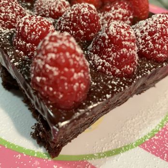 My Sisters Kitchen - Our decadent Brownie topped with dark chocolate ganache and fresh raspberries. - Party & Event Planning Near Me My Sisters Kitchen - Our decadent Brownie topped with dark chocolate ganache and fresh raspberries. - Party & Event Planning Near Me