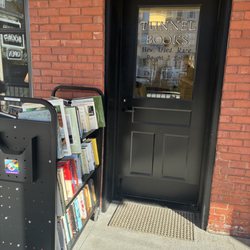 Tunnel Books - Tunnel Books door and two dollar book cart