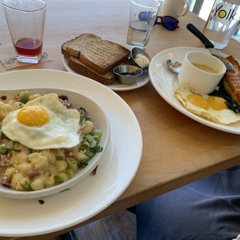 Yolk - South Loop - We ordered the Mac and cheese, toast, and salmon with cheesy grits, cranberry and flat white (left to right). - Breakfast & Brunch Near Me - Chicago, Illinois Yolk - South Loop - We ordered the Mac and cheese, toast, and salmon with cheesy grits, cranberry and flat white (left to right). - Breakfast & Brunch Near Me - Chicago, Illinois