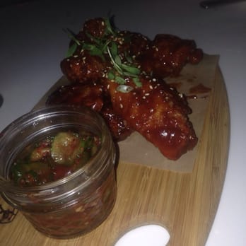 Magnolia House - Korean fried chicken wings, sweet and spicy chill sauce with kimchi cucumbers! - Cocktail Bars Near Me - Pasadena, California
