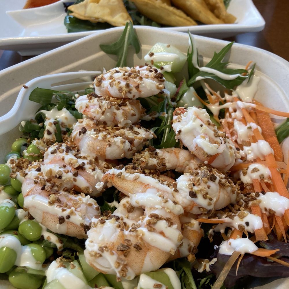 Poke Bowl with shrimp, avocado, carrots, celery, edamame, and scallions, on fresh greens. Excellent crab Rangoon in the background! Poke Bowl with shrimp, avocado, carrots, celery, edamame, and scallions, on fresh greens. Excellent crab Rangoon in the background!
