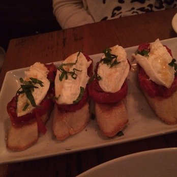 Otto Strada - Crostini with buratta, roasted tomatoes, and honey. - Italian Near Me - Hoboken, New Jersey