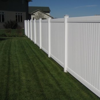 Miguel Landscaping - a white vinyl fence - Landscaping Near Me