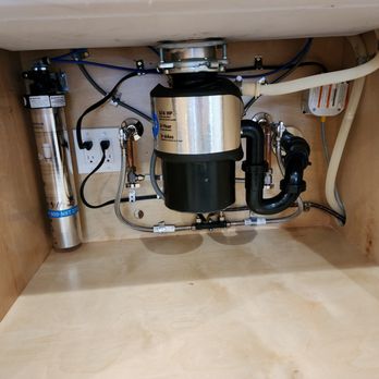 Professional Plumbing - Professional under-sink installation featuring a garbage disposal unit and a water filtration system - Plumbing Near Me - Fountain Valley, California Professional Plumbing - Professional under-sink installation featuring a garbage disposal unit and a water filtration system - Plumbing Near Me - Fountain Valley, California