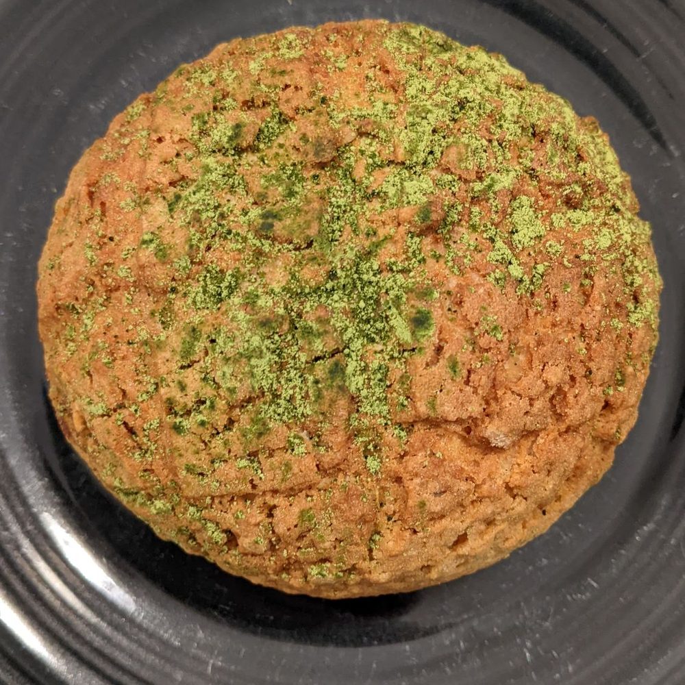 Norimoto Bakery - a closeup of a baked item on a black plate - Bakeries Near Me - Portland, Maine Norimoto Bakery - a closeup of a baked item on a black plate - Bakeries Near Me - Portland, Maine