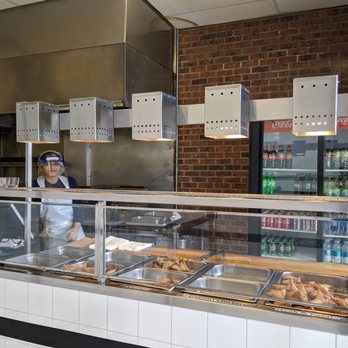 Sultan of Samosas - a man behind the counter - Indian Near Me - Toronto, Ontario Sultan of Samosas - a man behind the counter - Indian Near Me - Toronto, Ontario