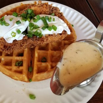 The Attic - Fried chicken breast and waffle with poached eggs and gravy on the side - Breakfast & Brunch Near Me - Long Beach, California
