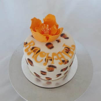 Tonna's Cakes - a leopard print cake with an orange flower on top - Bakeries Near Me - Brandon, South Dakota