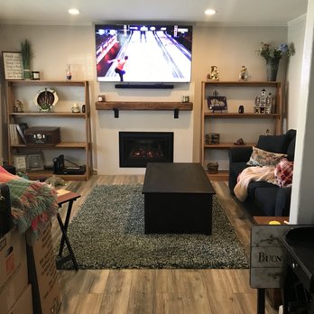 Christian Contracting - a living room with a flat screen tv - General Contractors Near Me Christian Contracting - a living room with a flat screen tv - General Contractors Near Me