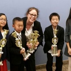 Kudos Education - Speech Coach Allison Kalmus with our students after award winning performances!