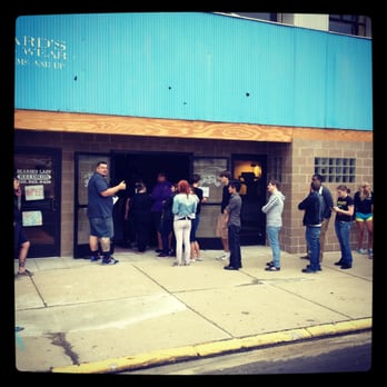 Flint Local 432 - a group of people standing outside of a building - Music Venues Near Me - Flint, Michigan