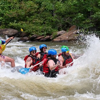 Cherokee Rafting - Ocoee River Whitewater - some people in a raft on the ocoee river - Rafting/Kayaking Near Me - Ocoee, Tennessee