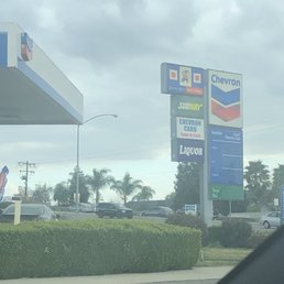 a view of a gas station from inside a car a view of a gas station from inside a car