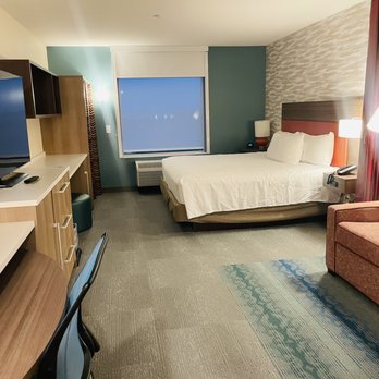 Home2 Suites by Hilton Mesa Longbow - Bedroom with couch and desk. - Hotels Near Me - Mesa, Arizona Home2 Suites by Hilton Mesa Longbow - Bedroom with couch and desk. - Hotels Near Me - Mesa, Arizona