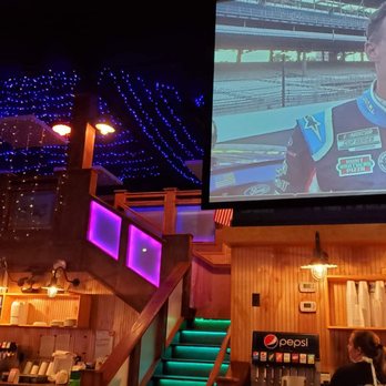 OPS Pizza Kitchen & Cafe - a man on a large screen - Italian Near Me - Kingsland, Georgia
