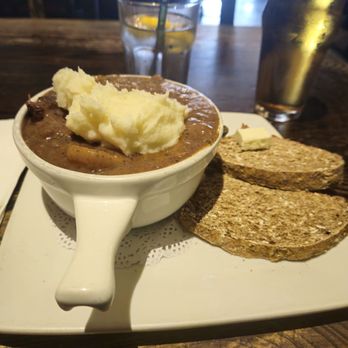 The Auld Dubliner - Guinness Stew at Auld Dubliner with brown bread and Irish butter - Irish Near Me - Long Beach, California The Auld Dubliner - Guinness Stew at Auld Dubliner with brown bread and Irish butter - Irish Near Me - Long Beach, California