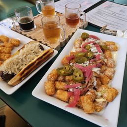 Pulled pork tochos, brat, flight