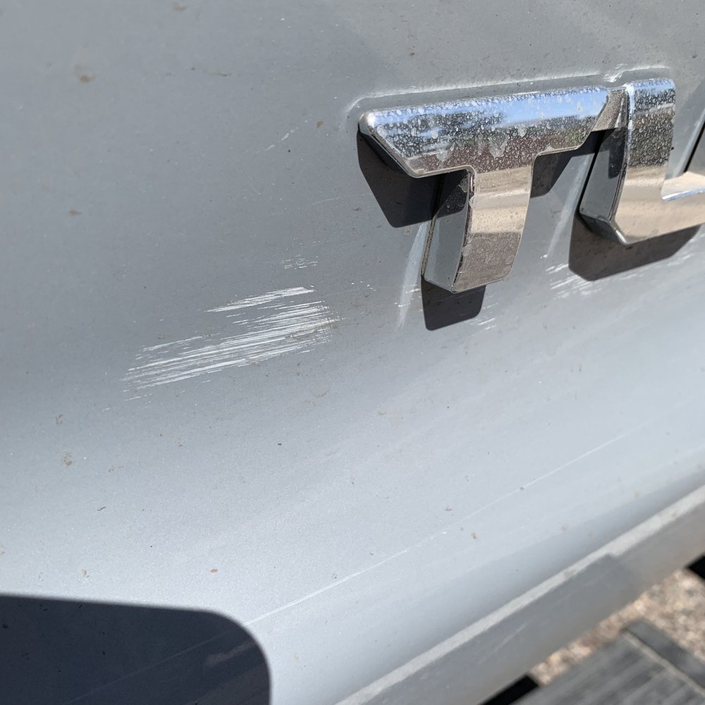 Either polish or paste wax left from detail