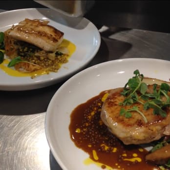 Metacom Kitchen - bone in pork loin (front) and market fish special - New American Near Me - Warren, Rhode Island