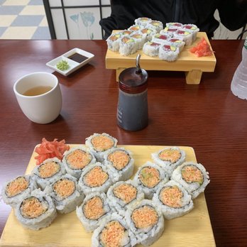 Sushi Red - Spicy crab roll, salmon and tuna avocado rolls in the background. Complimentary tea as well - Sushi Bars Near Me - Plainville, Connecticut
