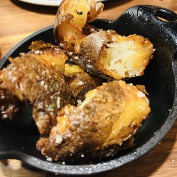 Tupelo Honey Southern Kitchen & Bar - Rosemary & Parmesan Crispy Potatoes - Southern Near Me - Franklin, Tennessee Tupelo Honey Southern Kitchen & Bar - Rosemary & Parmesan Crispy Potatoes - Southern Near Me - Franklin, Tennessee