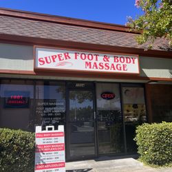 Super Foot Massage - Front store view with price list.