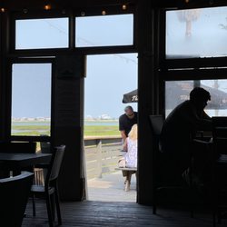 Hot Fish Club - Right on Murrell's Inlet Marsh. But away from the more touristy area. Great place for locals.