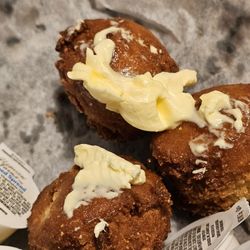 Wildwood Smokehouse of Roanoke - The inside of the basket full of Hushpuppies with butter.