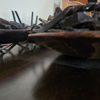 Molly Maid of St. Petersburg / Clearwater - Top of tv stand, didn't move decorative bowls, just dusted around - Home Cleaning Near Me - Clearwater, Florida