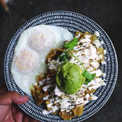 The Nest: A Brunch Joint - This is our chilaquiles plate with salsa verde, crema, queso fresco, avocado and eggs any style
