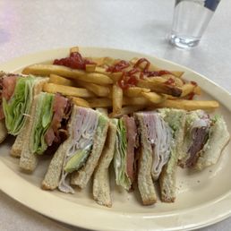 This is the club sandwich with avocado and fries. I almost finished the first wedge before I stopped to take a photo. Just couldn't wait! This is the club sandwich with avocado and fries. I almost finished the first wedge before I stopped to take a photo. Just couldn't wait!