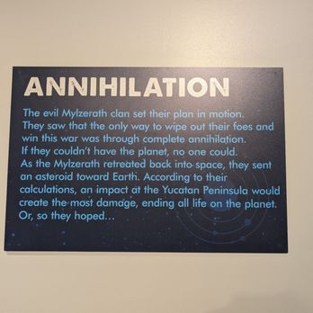 Shell - A sign titled 'ANNIHILATION' features a space-themed background and text describing a fictional story involving the Myzerath clan and an asteroid impact. - Gas Stations Near Me - Dragoon, Arizona