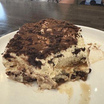 Sette Pasta House - Tiramisu with one big bite taken from it. OMG. - Italian Near Me - Granite Bay, California Sette Pasta House - Tiramisu with one big bite taken from it. OMG. - Italian Near Me - Granite Bay, California