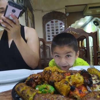 Zeeshan Kebabish - The boy in the green is the real Zeeshan, getting ready start on the Zeeshan Tandoori sampler, fyi.. it was delicious. - Pakistani Near Me - Barcelona, B Zeeshan Kebabish - The boy in the green is the real Zeeshan, getting ready start on the Zeeshan Tandoori sampler, fyi.. it was delicious. - Pakistani Near Me - Barcelona, B